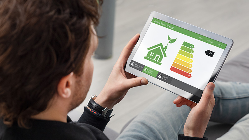Person using an energy efficiency tablet app.