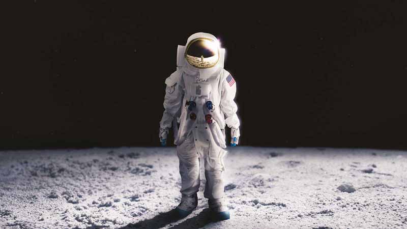 An astronaut standing on the Moon.