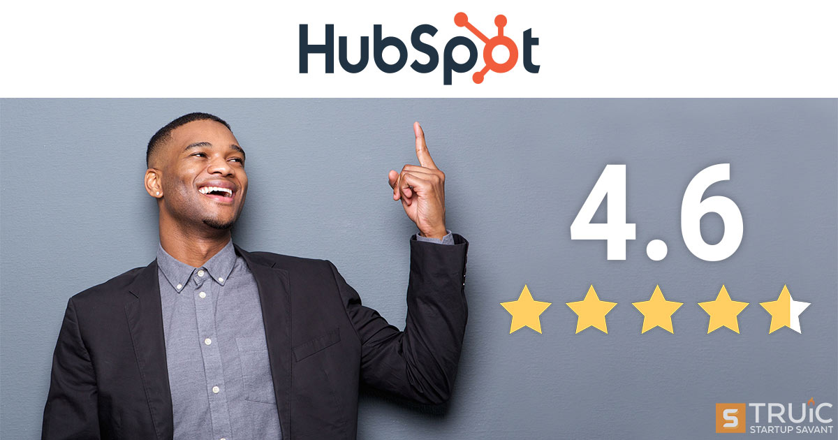 Smiling businessman next to 4.6 stars and pointing at HubSpot logo.