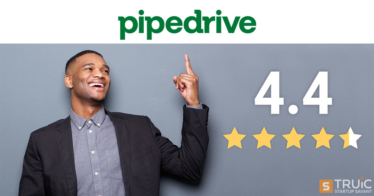 Smiling businessman next to 4 stars and pointing at Pipedrive logo.
