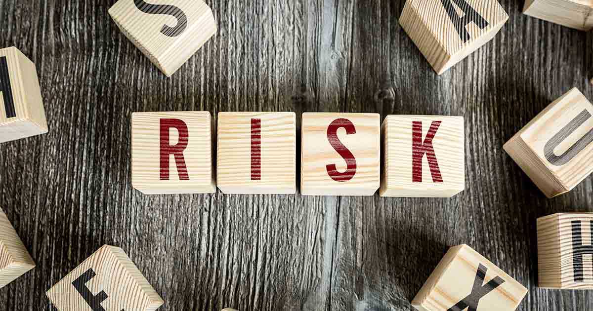 Wooden blocks that spell "Risk."