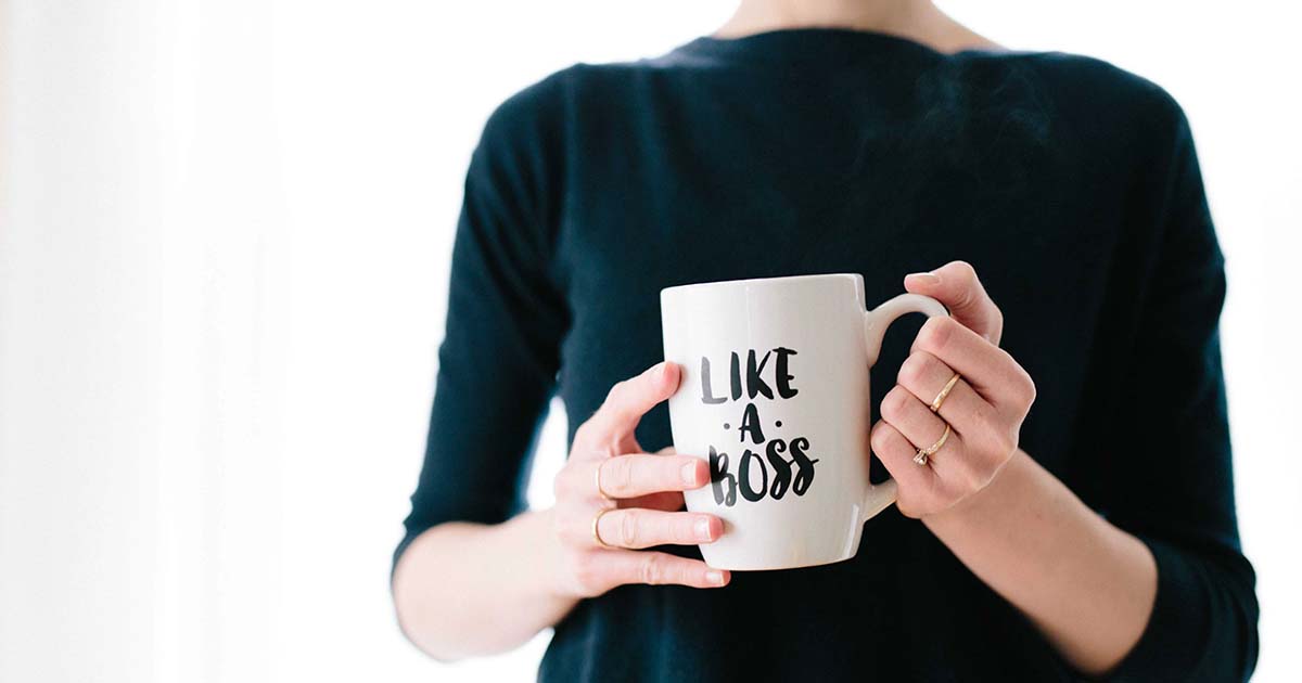 https://cdn.startupsavant.comWoman holding "Like a Boss" mug